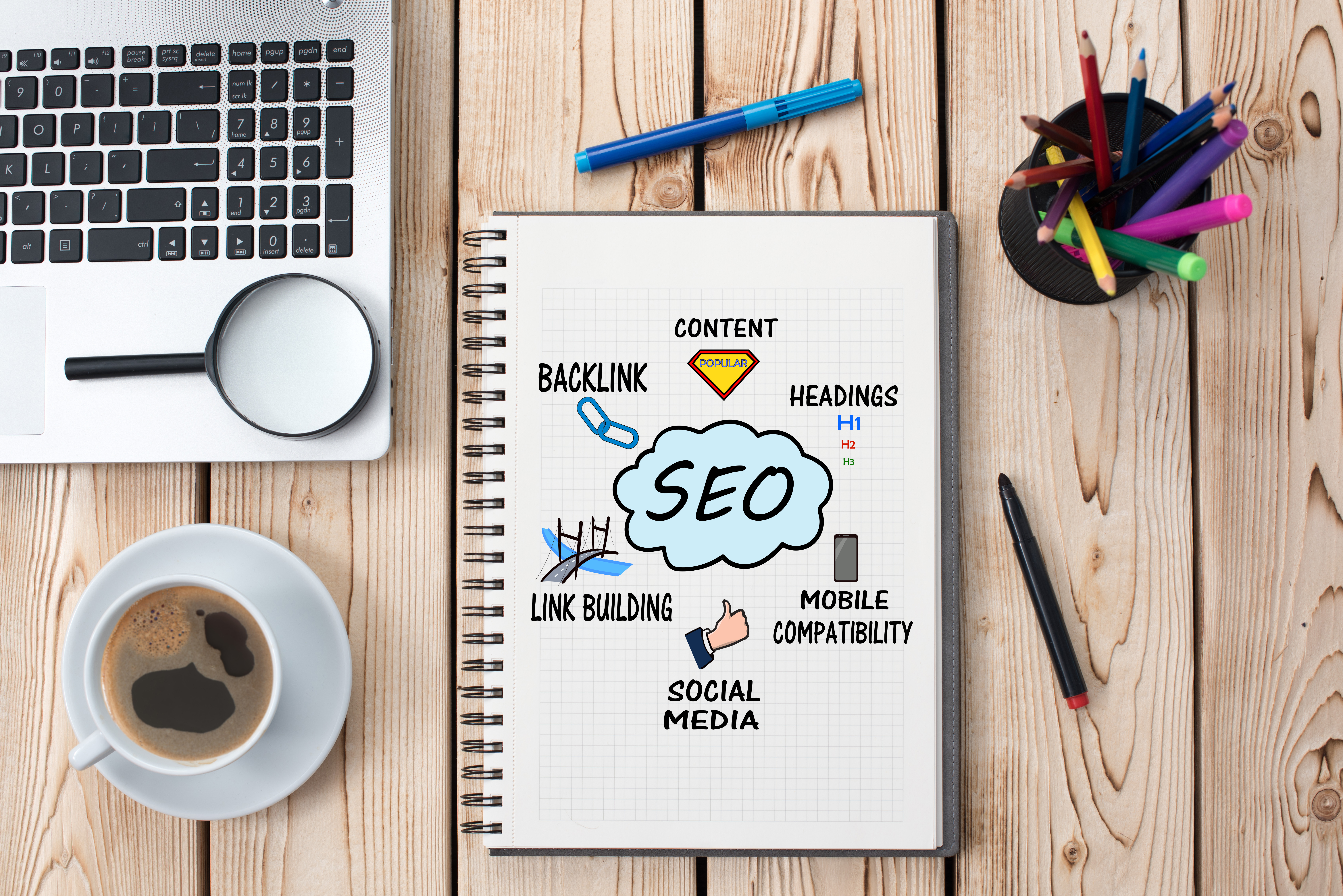 Notebook on table with search engine optimization graphic organizer on it